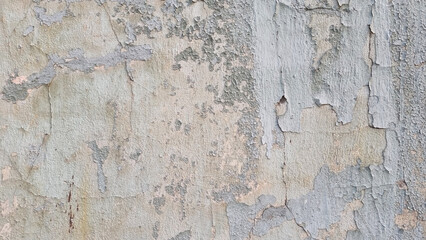 Naklejka premium Peeling paint on an old wall. Grunge background for design.Selective focus