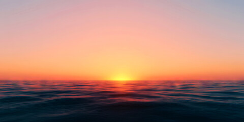 Obraz premium A serene sunset over the ocean, casting vibrant colors across the sky and reflecting softly on the water's surface.