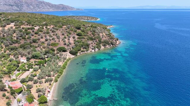 Aerial footage of the colorful waters of the Aegean sea on Samos island