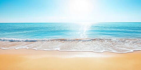 A serene beach landscape with gentle waves and a bright sun illuminating the clear blue ocean on a peaceful day.