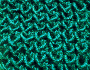 Texture of the pattern from green wool. Sample of the pattern close-up.