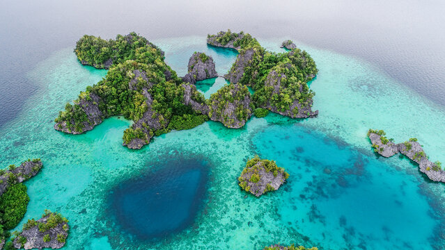 Beautiful beach in coast of lagoon. Aerial view of Raja ampat, indonesia. summer background