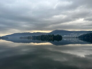 Sunrise in the cloudy sky over the river Minho and surrounding mountains near Eiras, O Rosal, Galicia, Spain, December 2022