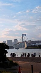 Rainbow bridge in Odaiba in Tokyo view from beach 