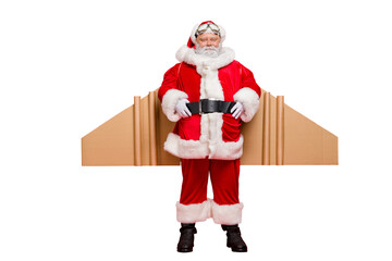Ready for flight! Full length photo of cool charming santa claus with airplane cardboard imagine wings  wear  fairy costume belt isolated over red color background