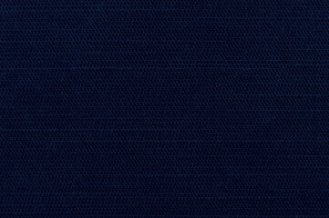 A close-up of the dark blue linen fabric. Dark blue textured background image.