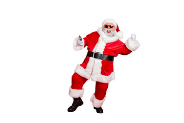  Forever young! Full length photo of excited santa in hat using cell phone device raising fists screaming yes have party wearing belt eyeglasses eyewear isolated over red background