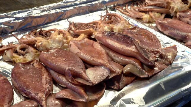 Grill squid in Souel Korean market street food close up shot