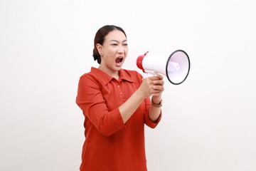Serious woman of Asian hold scream shout in megaphone announces discounts sale Hurry up isolated on...