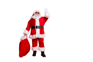 Full length body size view of his he cheerful funky fat overweight plump gray-haired bearded man carrying purchases waving greetings congrats tradition isolated over bright vivid shine red background