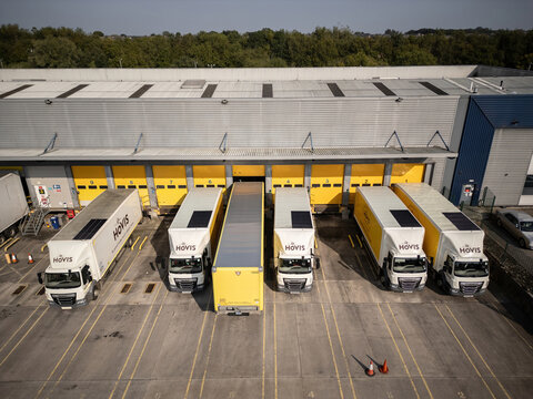 HAYDOCK, UK - SEPTEMBER 07, 2024: Drone aerial view of Hovis bread bakery warehouse and vehicles in England