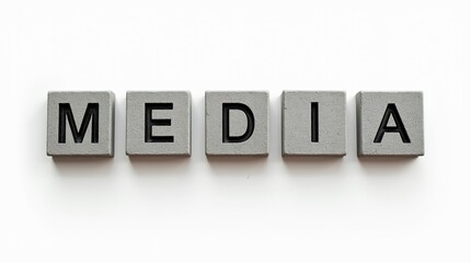 The word media carved in stone blocks on white background
