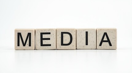 Media text carved in stone blocks on a white background