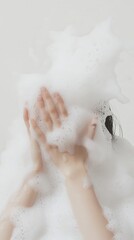 Woman taking bath with shower gel in bathroom, closeup