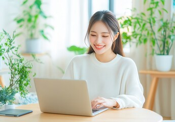 Asian woman using laptop computer.