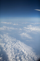 view of the clouds from airplane vertical