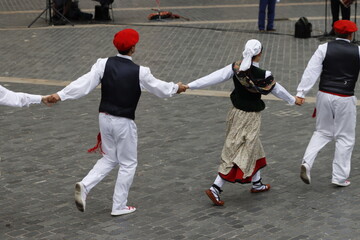 Basque folk dancers during a performance in an outdoor festival