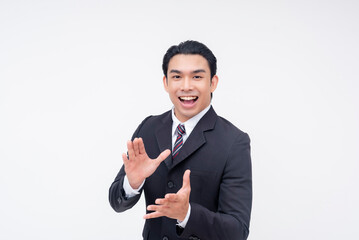 Naklejka premium A happy young asian business executive applauding someone's efforts, clapping with his hands. Giving rousing encouragement. Isolated on a white background.