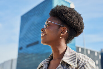 Smiling Woman with Glasses in Urban Cityscape