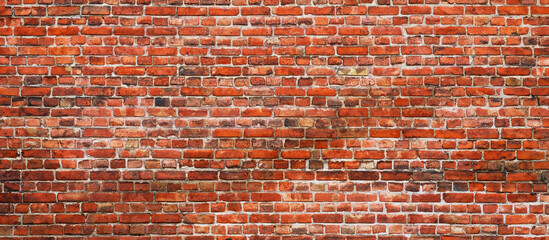 Naklejka premium wide and empty vintage brickwall texture background. Panoramic urban backdrop