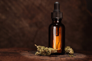 CBD Oil Bottle with Dried Hemp Flowers