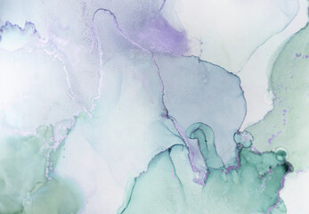 Abstract watercolor artwork showcasing delicate hues of green and purple in soft layers and flowing shapes