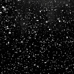 Snow falling on a black background