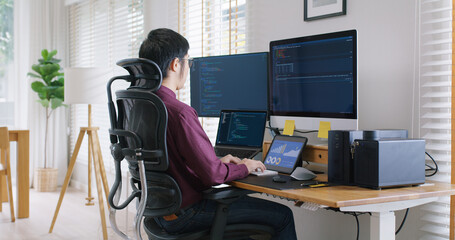 Digital transformation future workforce web DEV career development. Asia people young talent man busy work at home office reskill upskill martech job remote test on AI cloud computing cyber security.