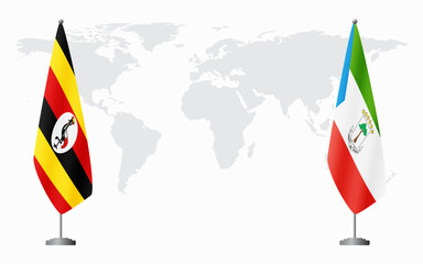 Uganda and Equatorial Guinea flags for official meeting against background of world map.