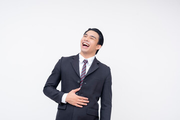 A young cheerful asian business executive in a suit and tie having a hearty laugh. Isolated on a white background.