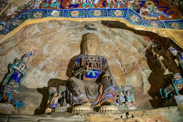 Ancient Buddha statues inside the Yungang Grottoes, which located near Datong in Shanxi Province,...