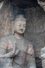 Ancient Buddha statues inside the Yungang Grottoes, which located near Datong in Shanxi Province,...