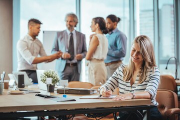 Business Team Meeting with Colleagues in Modern Office Setting