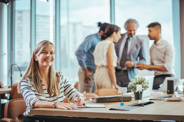 Confident Woman in Modern Office Meeting Environment
