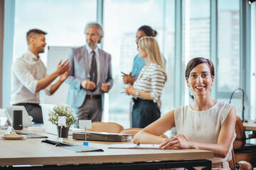 Smiling Businesswoman in Modern Office Team Meeting