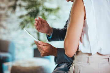Colleagues Collaborating Using a Tablet in Office Setting