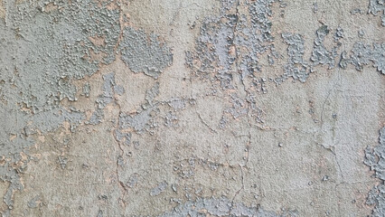 Peeling paint on an old wall. Grunge background for design.Selective focus