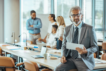 Confident Businessman Leading a Dynamic Office Meeting