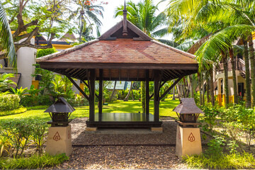 beautiful wooden gazebo in tropical nature in Thailand