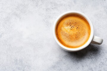 Cup of fresh espresso on textured background