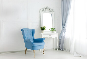 blue armchair in loft living room. floor vase indoor.