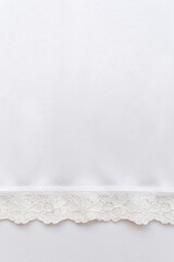 Obraz premium White fabric with a lace border.