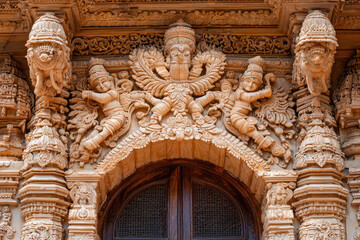 Fototapeta premium Intricate carvings adorn entrance of traditional Indian palace, showcasing detailed craftsmanship and cultural artistry. ornate designs reflect rich heritage and architectural beauty of India