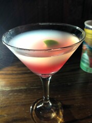 Cosmopolitan drink in a martini glass.