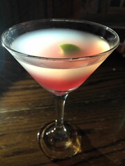 Cosmopolitan drink in a martini glass.