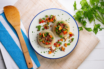 Baked onions stuffed with healthy vegetables. Top view table.