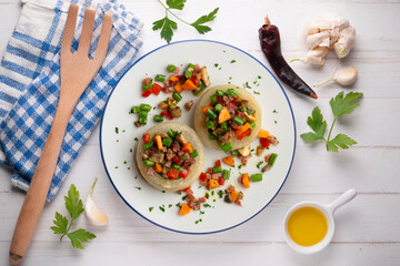 Baked onions stuffed with healthy vegetables. Top view table.