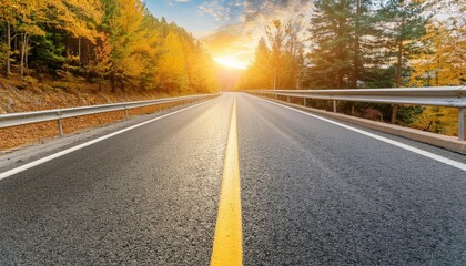 Fototapeta premium empty asphalt highway and winter forest nature landscape at sunrise