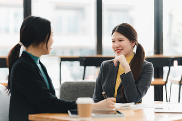 Engaging conversation between two women in modern office setting