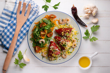 Red piquillo peppers stuffed with shrimp. Top view table.